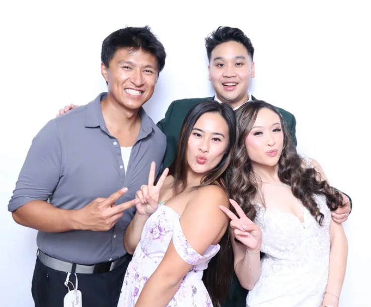 Group of four friends at a wedding